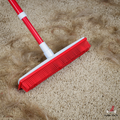 IndigoPet Hair Removal Broom with sturdy handle and brush head, designed for effective pet hair cleanup on floors.